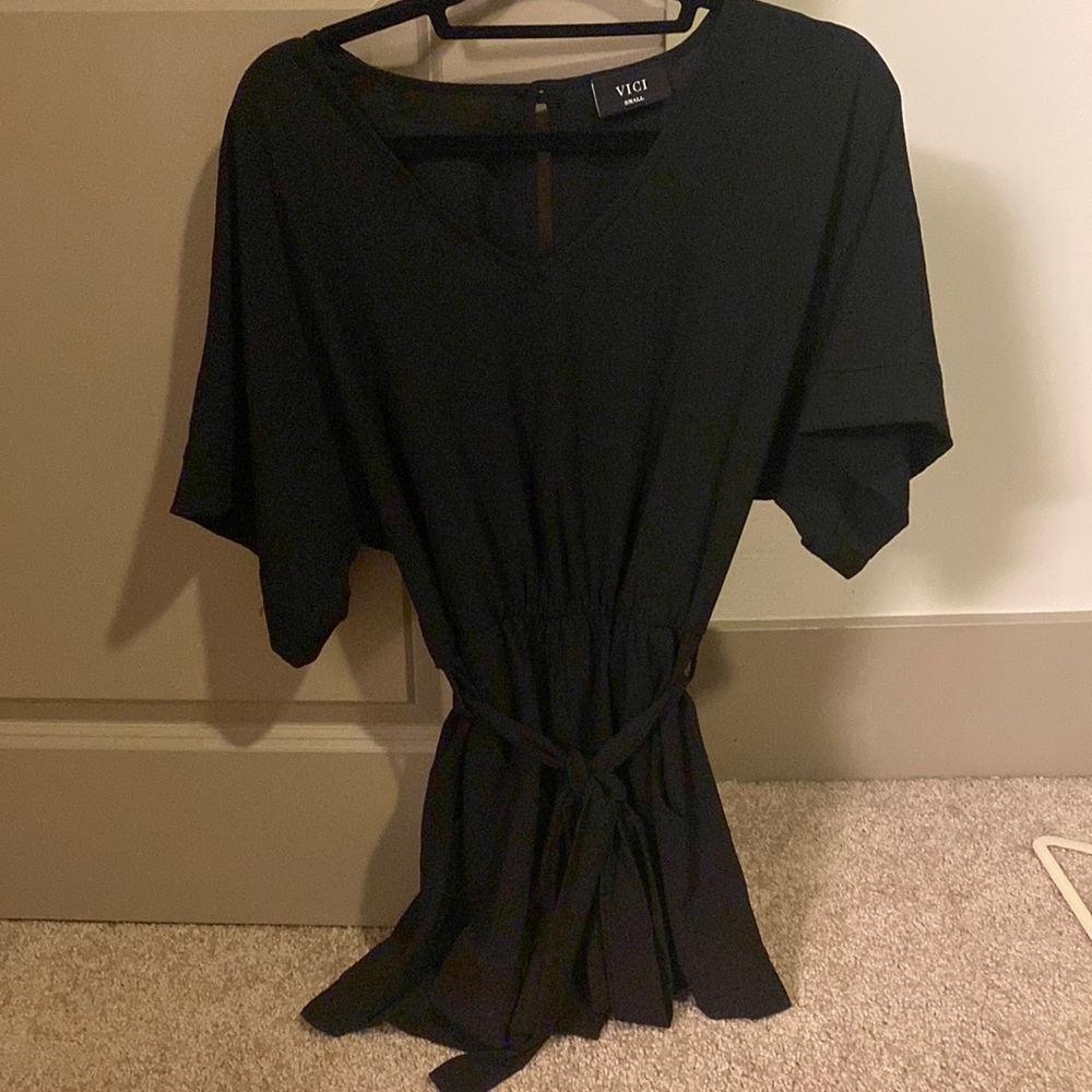 Cute and flirty black romper. Been worn one time. Can dress up or down